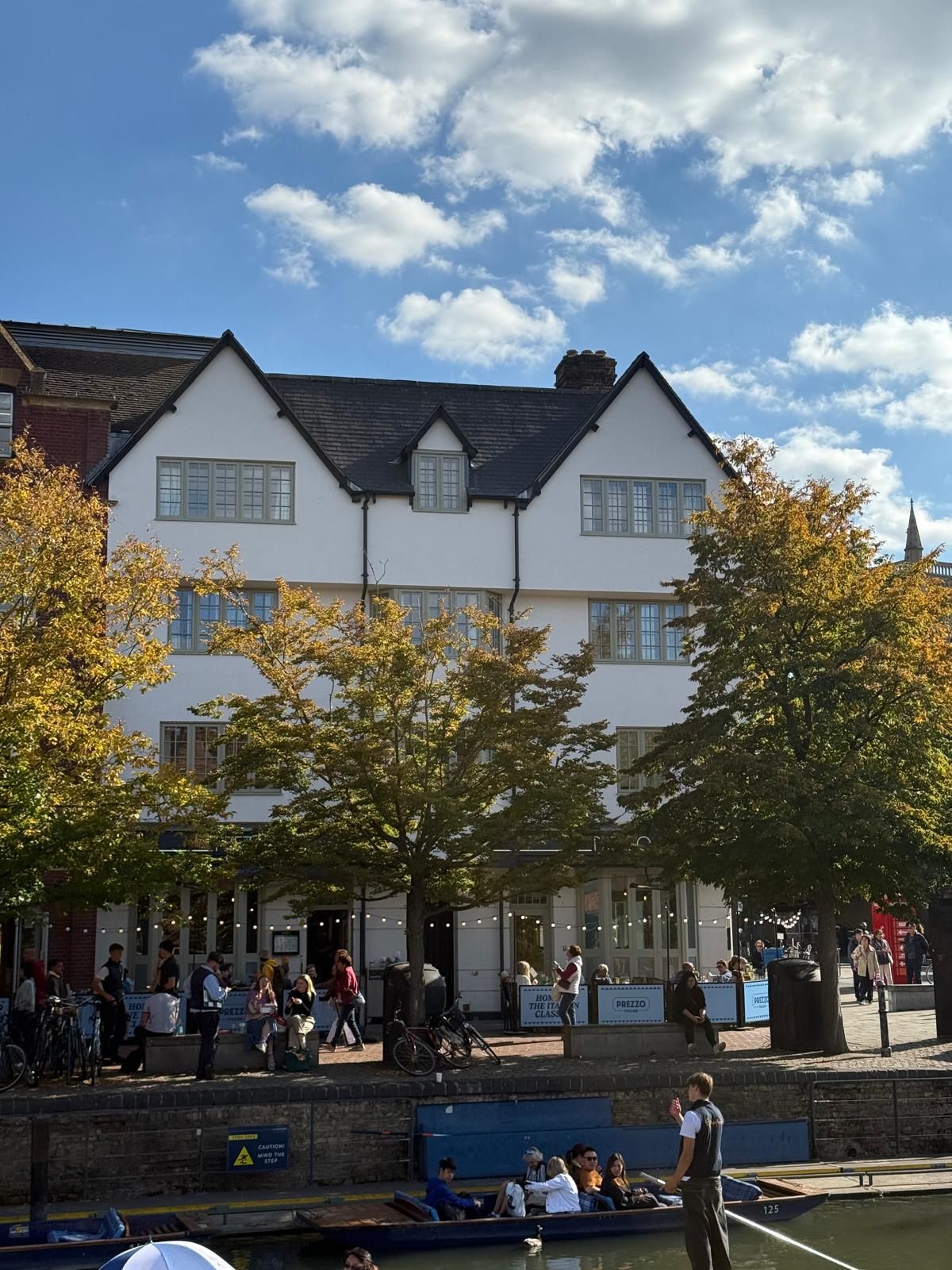 Basing House building facade seen from Quayside with punters on the river below