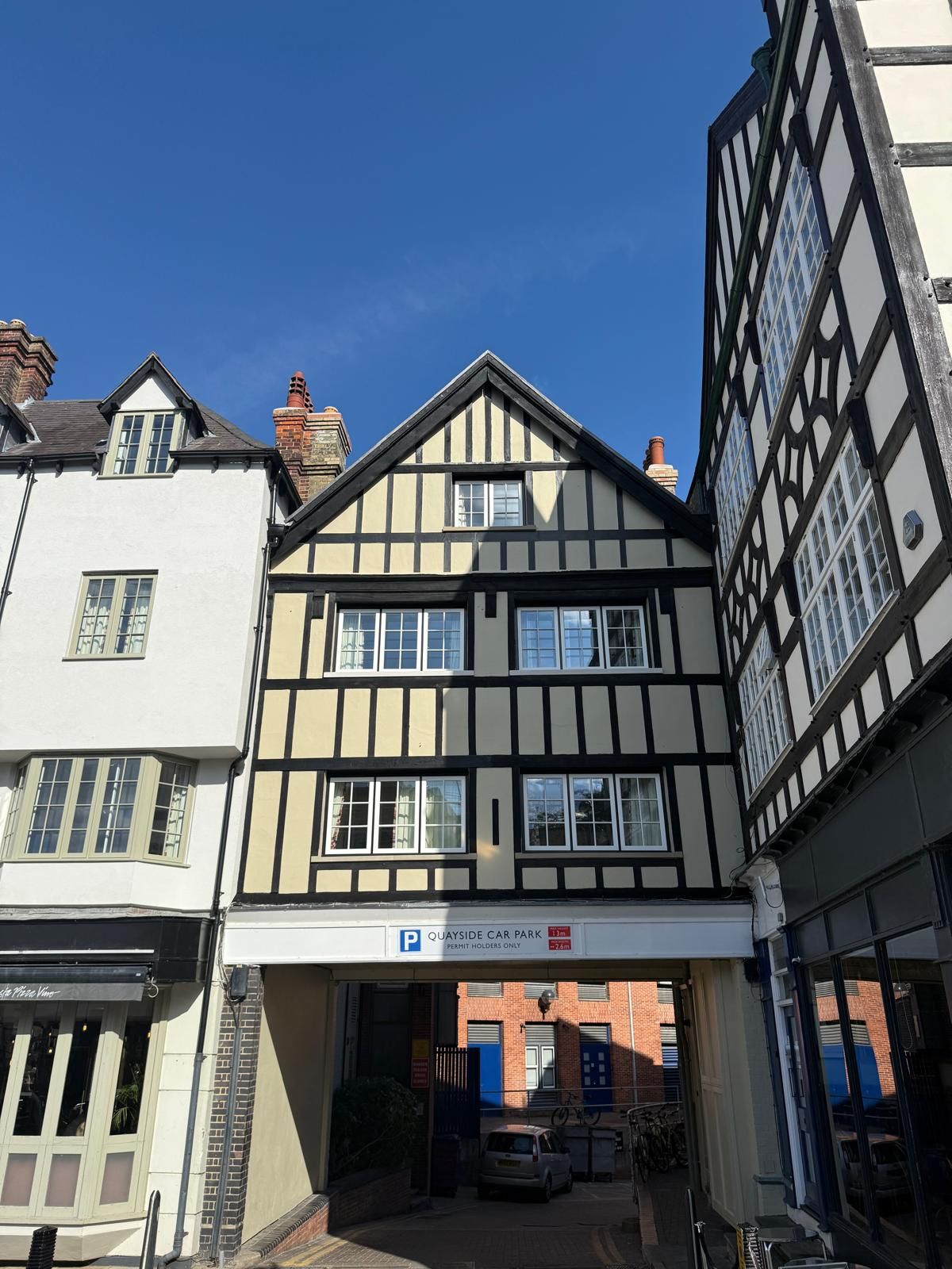 Basing House gable end and new windows viewed through the Quayside car park archway