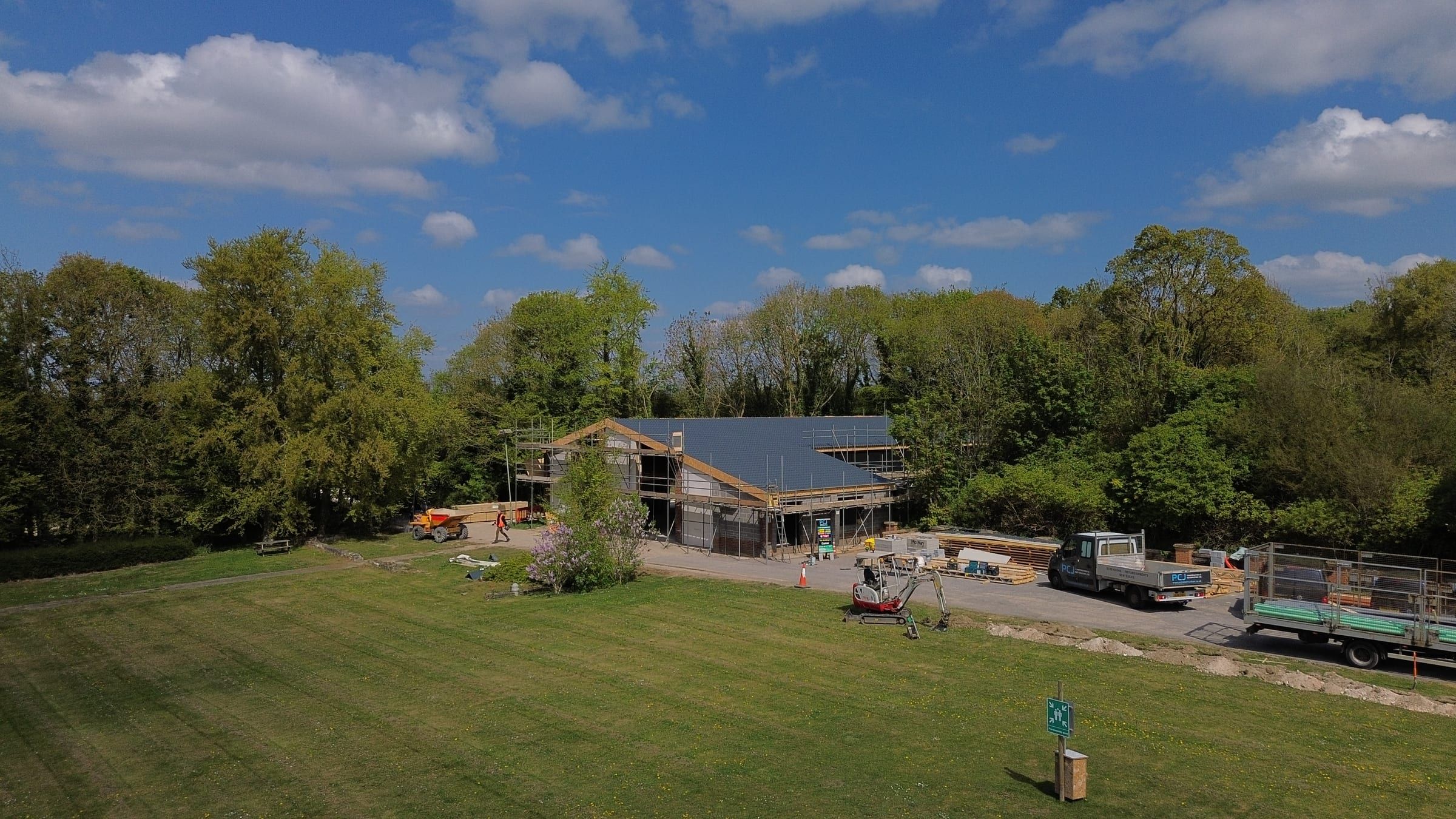 Aerial view of Chilford Hall barn conversion with new tiled roof and scaffolding
