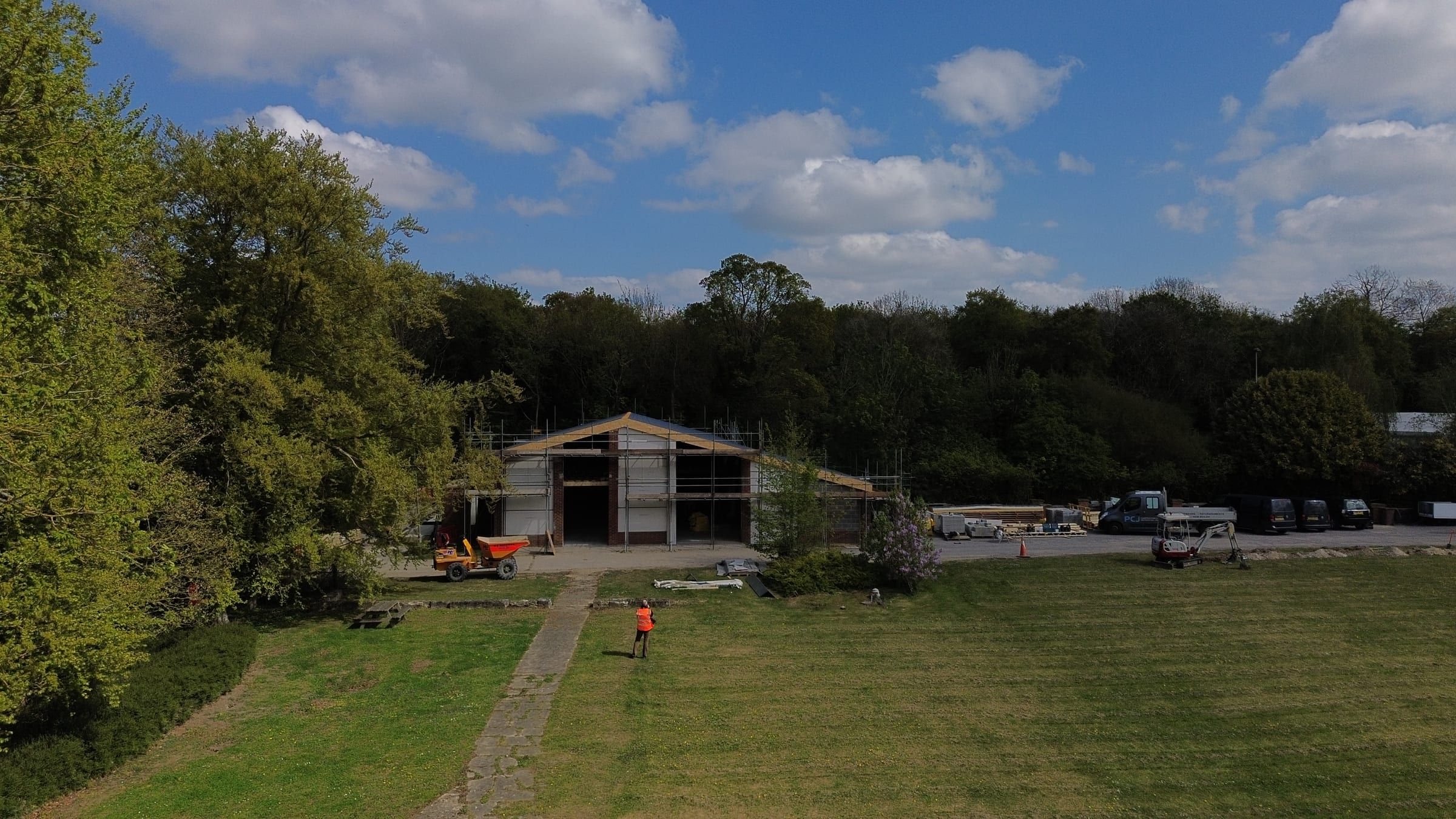 Aerial view of Chilford Hall barn renovation site with worker and machinery